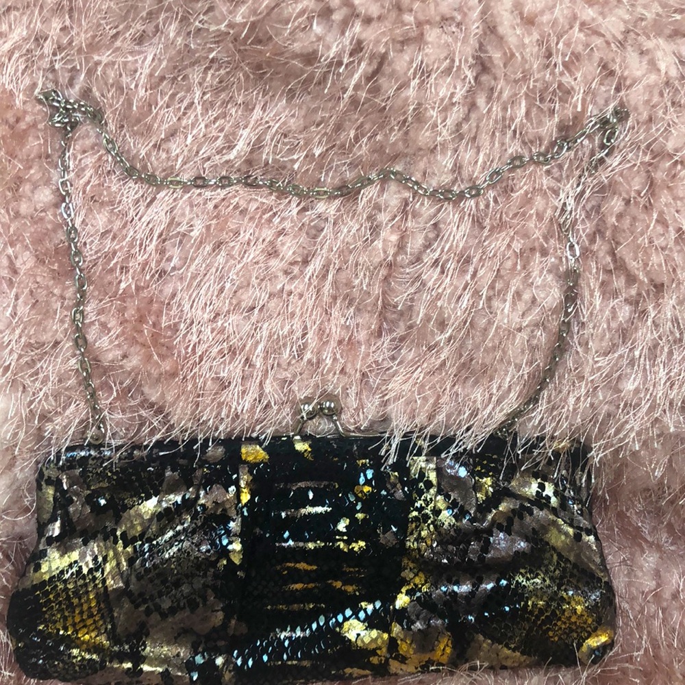 Gold and black snake skin clutch